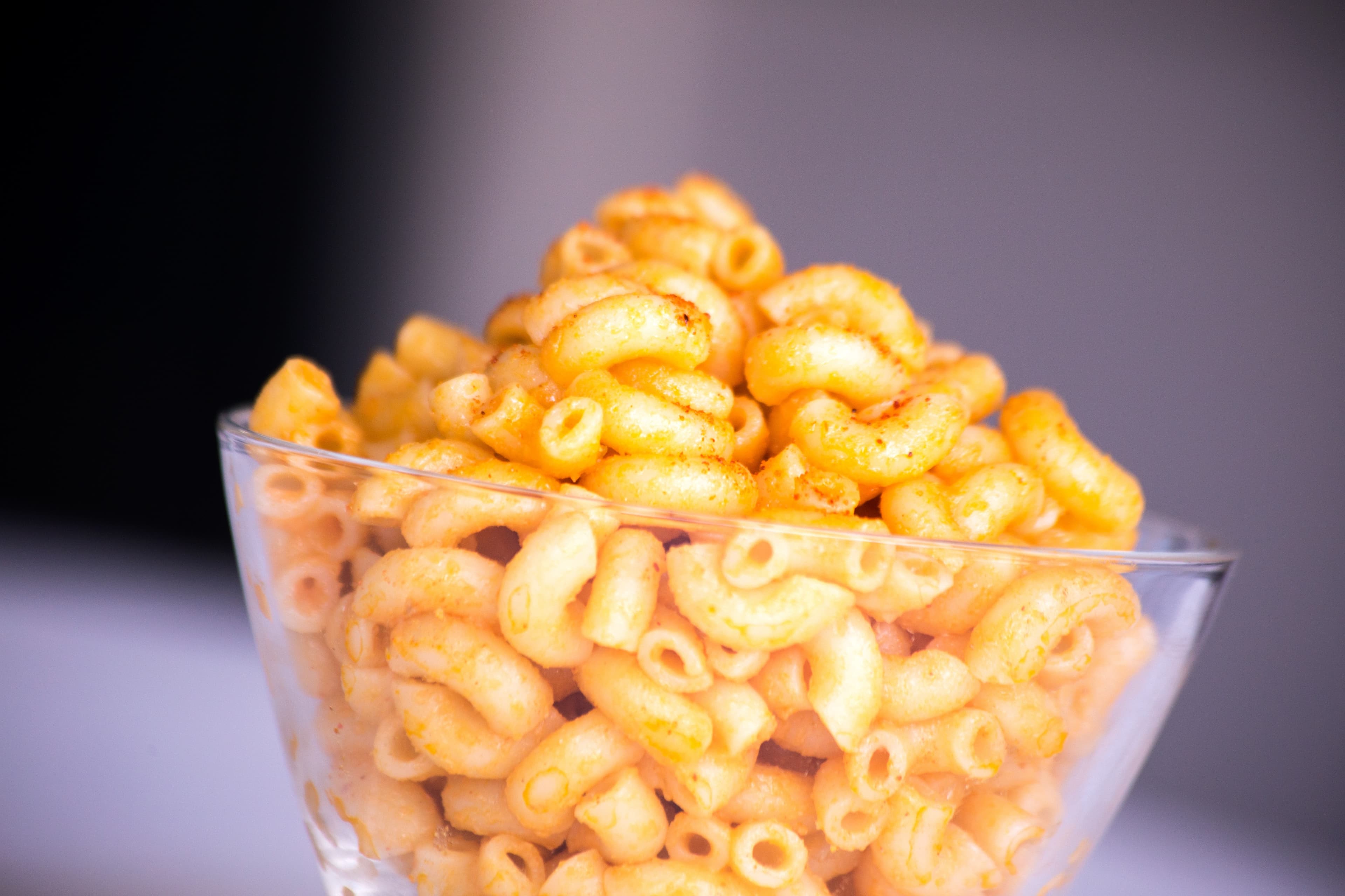 Mac and cheese in a glass bowl.